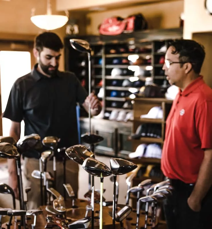 Client buying a driver in a Pro shop